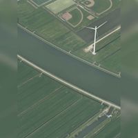 Luchtfoto gezien vanuit het zuiden met diagonaal het Amsterdam-Rijnkanaal met bovenaan het honk- en softbalveld aan de Groene Hoon en de winmolen 'De Poldermolen' in 2019. Foto: Slagboom en Peeters Luchtfotografie B.V..