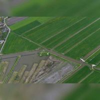 Luchtfoto gezien vanuit het noorkdwesten met links de Schalwijkse Achterdijk met de Blokhovense Molenvliet in Tull en 't Waal in 2019. Foto: Slagboom en Peeters Luchtfotografie B.V..