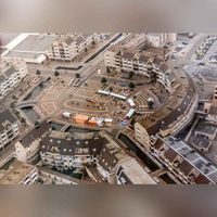 Luchtfoto van Winkelcentrum Het Rond met middenboven het Onderdoor en rechtsonder het Schonenburgseind in 1988. Bron: RAZU, 033.